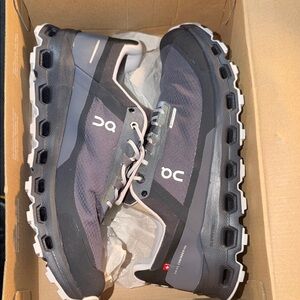 On Running Women’s Trail Sneakers in Black and Gray